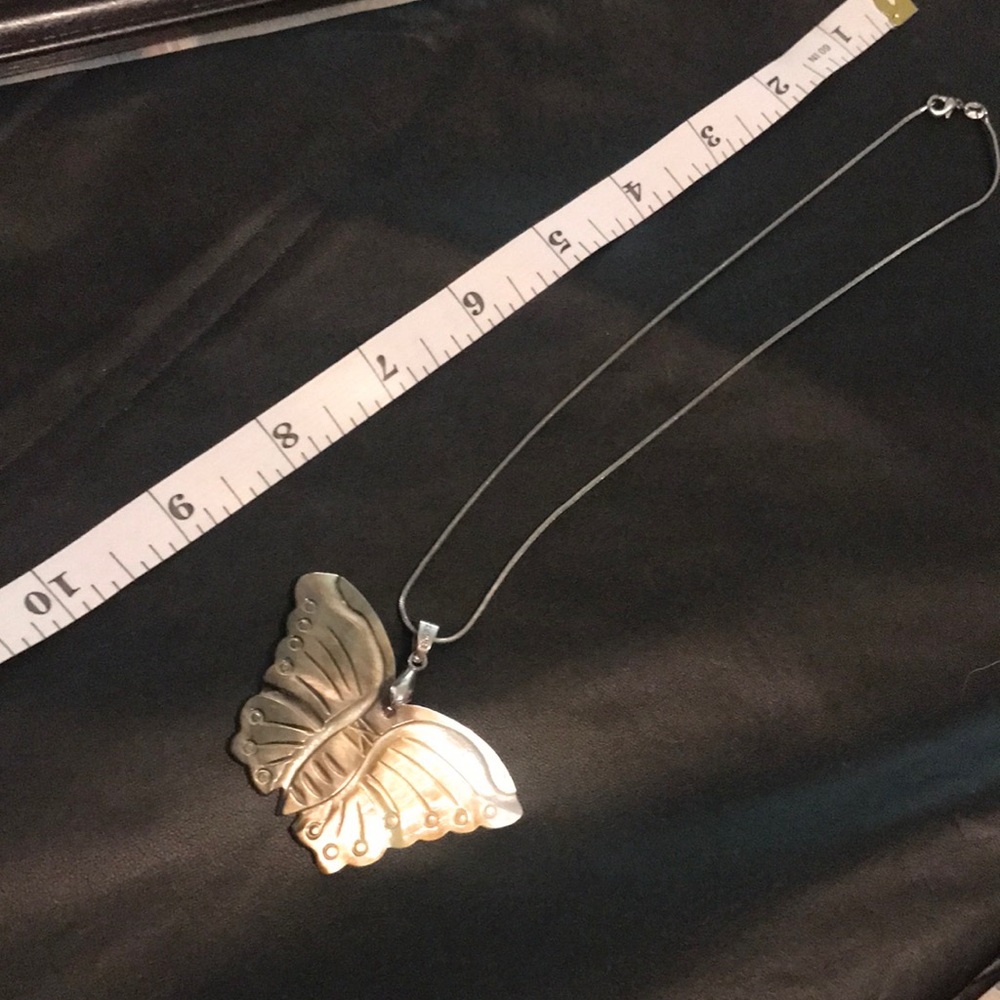 Handmade Abalone Shell Butterfly pendant necklace on silver chain.